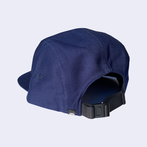 Back view of navy cap, with adjustable strap to change fit.