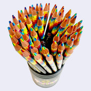 Black cup filled with rainbow colored pencils, each pencil containing 7 colors and an HB lead in one tip.