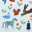 Transparent stickers with animal and nature designs on a white background