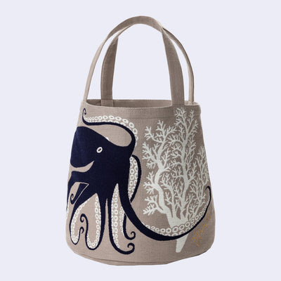 Tote bag with octopus design on a beige background