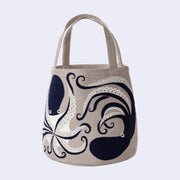 Tote bag with an octopus design on a light gray background