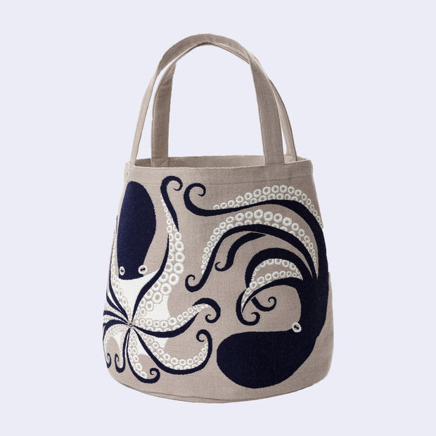 Tote bag with an octopus design on a light gray background