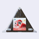 A packaged triangular onigiri (rice ball) with a pull tab design, with stationery paper clips inside. The wrapper is clear, showing dark seaweed rice inside, with a central white and red label featuring an illustration of plums and Japanese text.