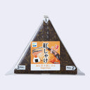 A packaged Onigiri Eraser sushi triangle with a salmon and spicy mayo flavor, featuring a colorful label with Japanese text and pull tabs numbered 1, 2, and 3.
