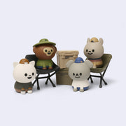 Set of cartoon animal figurines with accessories of outdoor gear.
