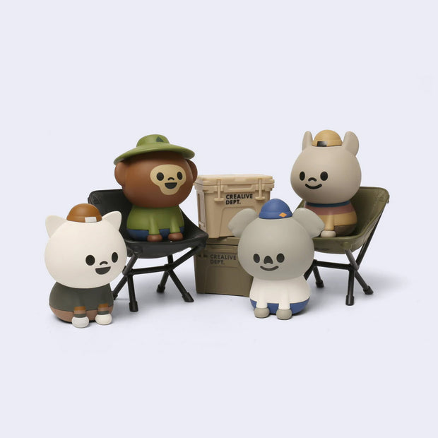 Set of cartoon animal figurines with accessories of outdoor gear.
