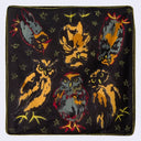 Black square fabric with colorful owl designs and star patterns