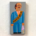 Painting of a man in a blue suit with a yellow sash on a gray background