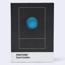Pantone Card holder in its original packaging, featuring a black box with a white bottom band and a blue circular cutout on the front.