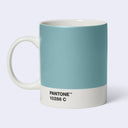 A ceramic mug designed like a Pantone color swatch, featuring a solid light blue-green exterior, a white handle and base, and the text 'PANTONE 10286 C' printed on the white base.