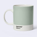 A ceramic mug designed like a Pantone color card, featuring a sage green upper body and a white lower band with the text 'PANTONE 5655 C'.