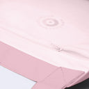 Close-up of a light pink zippered bag with a tonal circular logo reading 'COPENHAGEN DESIGN'