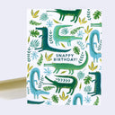 Birthday card with crocodile illustrations and 'Snappy Birthday!' text on a white background