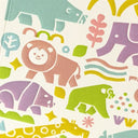 Close up detailing of embossed artwork on a greeting card of pastel cartoon animals.