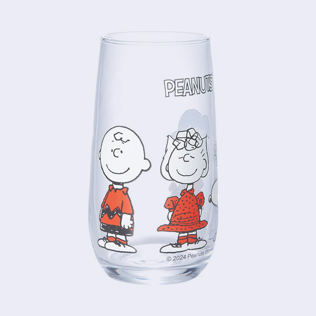 Clear glass with "Peanuts" written along the top and standing characters - Sally, Snoopy, Lucy and Charlie Brown colored only in white and orange.