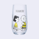 Clear glass with "Peanuts" written along the top and walking characters - Sally, Snoopy, Lucy and Charlie Brown colored only in white and yellow.