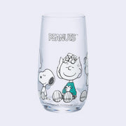 Clear glass with "Peanuts" written along the top and sitting characters - Sally, Snoopy, Linus and Charlie Brown colored only in white and teal.