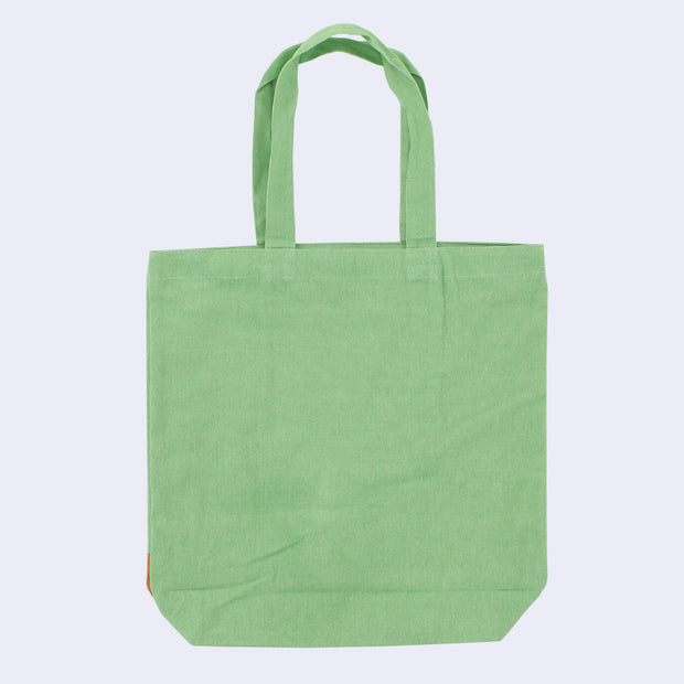 Back view of a green tote bag, the back left completely plain.