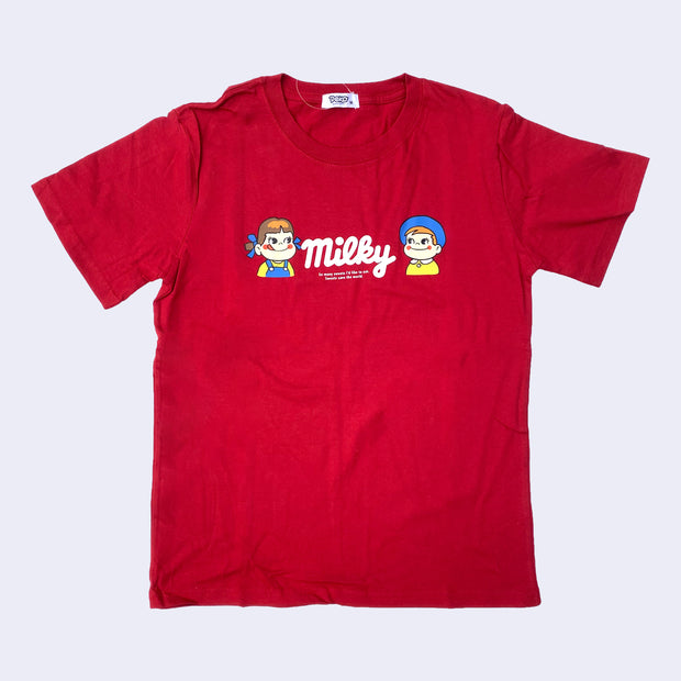 Red t-shirt featuring a drawing of Peko and Poko from Milky Chocolate bars, drawn from the chest up and looking at one another. In between them is a cursive white "milky" with smaller text directly below.