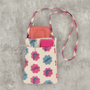 Peko Chan patterned crossbody shoulder bag, shown filled with various items in its outer pocket and a wallet peeking out of its main pouch.