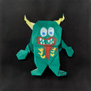 Colorful paper monster on a black background