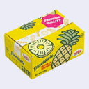 Small cardboard box, yellow in color and fashioned to look like a produce box of pineapples.