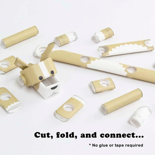 Partially assembled paper sculpture of a corgi, made out of cut paper pipes.