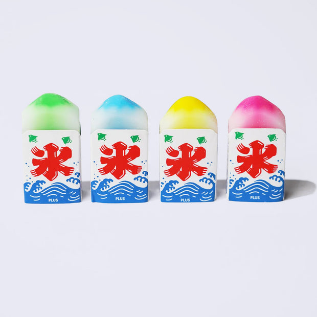 Four erasers that look like shaved ice with bright coloring and domed tops.