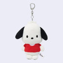 Plush dog keychain with a red shirt on a white background