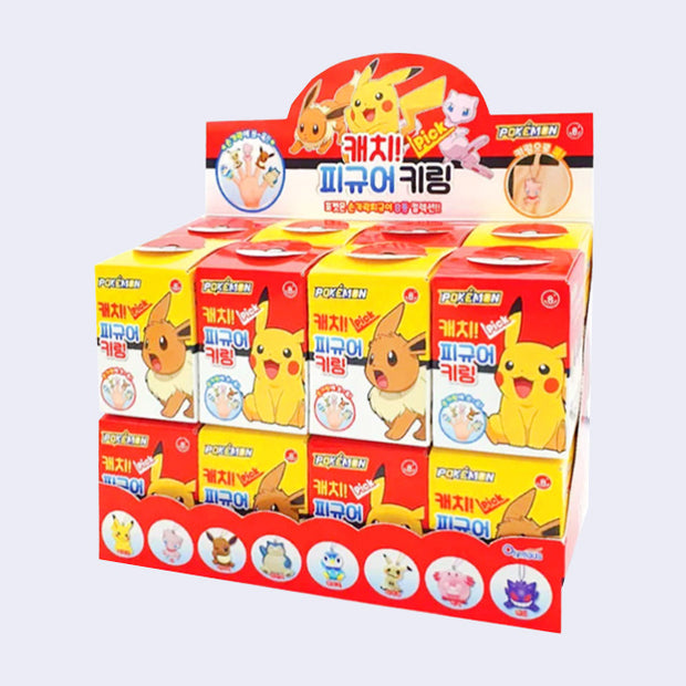 Display box of Pokémon themed products with cartoon characters on a white background