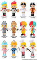 A grid of 12 cartoon-style toy figures with colorful outfits and props, each labeled with a color/theme name in Chinese and English. The figures include painter, astronaut, clown, detective, worker, and cook designs on a plain white background.