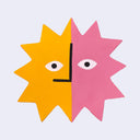 Die cut wooden painting in the shape of a multi pointed sun,, half yellow and half pink with only eyes and a straight nose.
