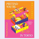 Book cover for 'Pretend You're in Tokyo' by Michelle Mackintosh, featuring a vibrant, colorful isometric illustration of a bento box with Japanese-themed items and a bicycle on an orange and pink background.