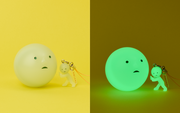 Glow in the dark capsule shaped like Smiski's face with a small Smiski strap accessory next to it.