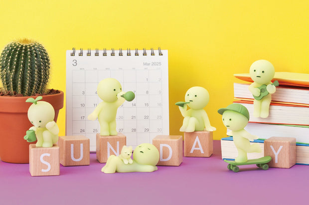 6 mini figures of Smiski characters, in various poses related to relaxation or fun activities. Options are: watering plant, blowing bubbles, sleeping w/ cat, flying a paper plane, skateboarding and playing ukelele.