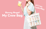 Promotional image of a girl holding a cream colored tote bag over her shoulder. The tote bag has 8 clear slots, which are all filled with different Sonny Angel figures.