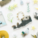Decorative stickers featuring an illustration of an otter holding a tambourine.