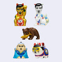 Five small decorative figurines arranged on a light gray background: a gold lucky cat, a white fox with multicolored accents, a brown bear holding a gold fish, a blue-robed figure, and a white cat with red, blue, and yellow details.