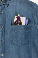 Folded handkerchief inside of someone's shirt pocket.