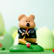 Vinyl figure of a cartoon quokka, holding a croquet mallet and soon to be swinging at the ball. 
