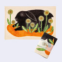 Tea towel with a black rabbit design on a white background