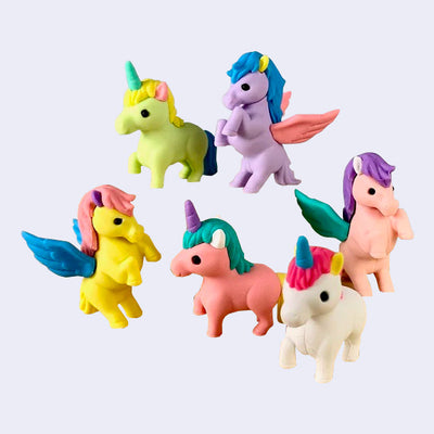 Colorful erasers shaped to look like unicorns, some with pegasus wings. 