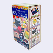 Box containing miniature food themed items, all Japanese meals or cookware.