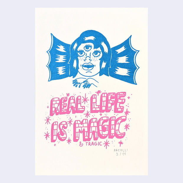 Print featuring the head of a 3 eyed girl with wings, who puts her hands over text that reads "Real life is magic & tragic."