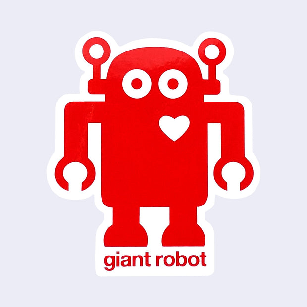 Die cut sticker of red robot with a white heart on its upper right chest. Text below reads "giant robot"