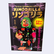 Large black box with pink decorative background text and gold shiny title text that reads "Ringorilla". It shows a large gorilla figure, with a half cyborg face and colorful limbs and clothing.