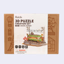Rolife 3D Puzzle Creation Set packaging with tram model on a light gray background