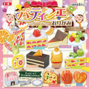 Toy origami set with cake models and packaging on a colorful background