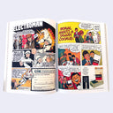 Open comic book with vintage illustrations and text.