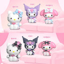 Six cartoon character figurines on a pink couch with a pink background
